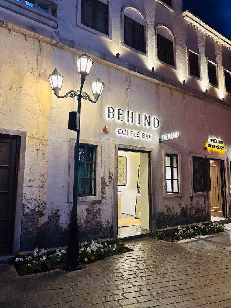 Behind