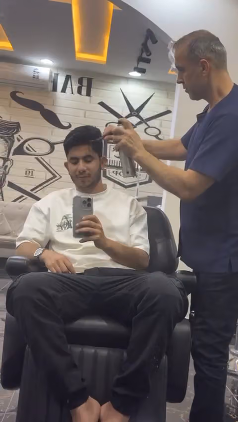 حلاق المميز توب